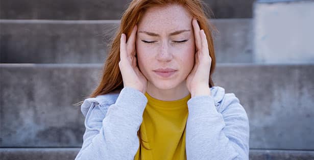 Woman in discomft from tinnitus